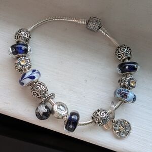 Pandora Bracelet with Charms: Blue Glass and Silver Floral Accents